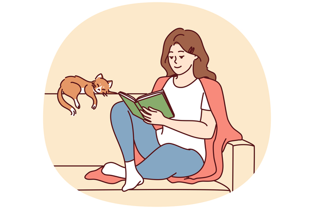 Happy woman reading electricity guide